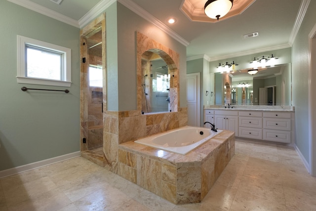 bathroom with independent shower and bath, ornamental molding, a wealth of natural light, and vanity