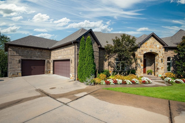 french country inspired facade with a garage