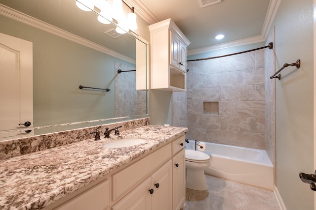 full bathroom featuring ornamental molding, toilet, tiled shower / bath combo, and vanity