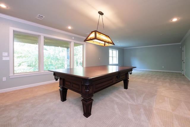 recreation room featuring ornamental molding and light colored carpet