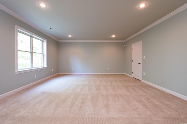 empty room with light colored carpet and ornamental molding