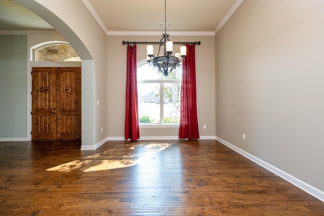 interior space featuring crown molding, dark hardwood / wood-style floors, and a notable chandelier