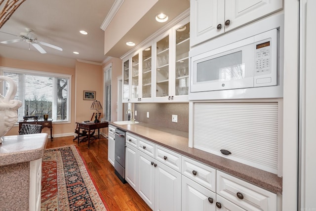 kitchen with dark hardwood / wood-style floors, ceiling fan, crown molding, dishwasher, and white microwave