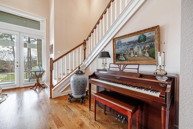 misc room with french doors and light wood-type flooring