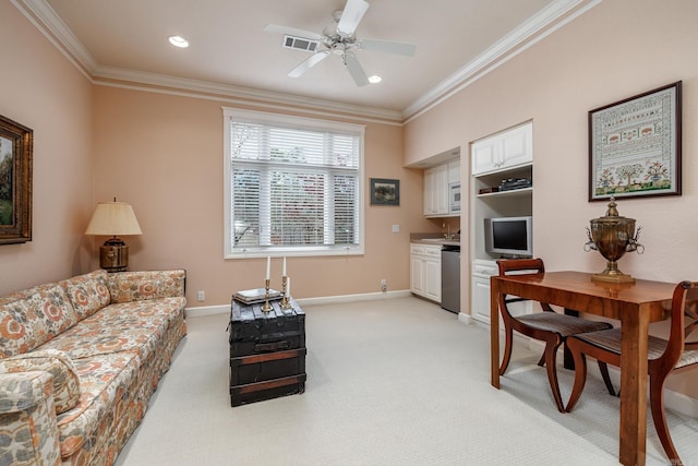 carpeted living room featuring ceiling fan and crown molding