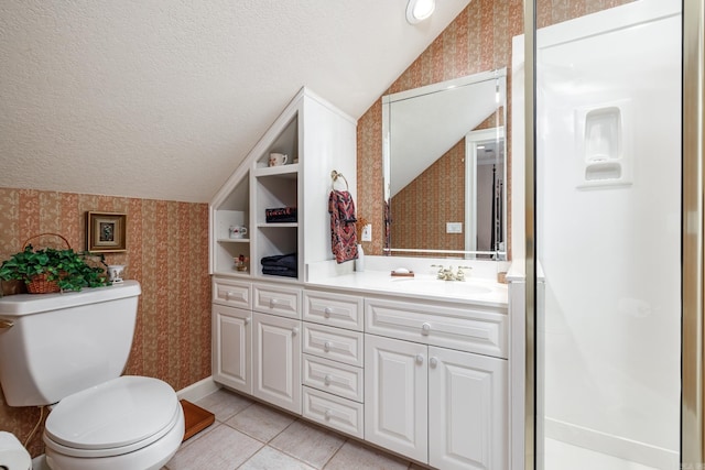 bathroom with a textured ceiling, toilet, tile patterned floors, lofted ceiling, and vanity