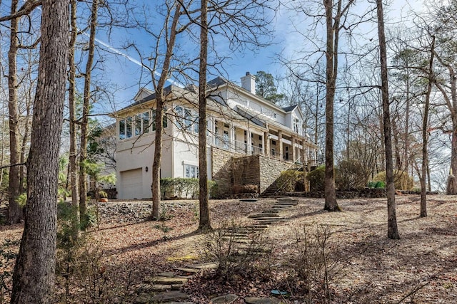 view of property exterior featuring a garage