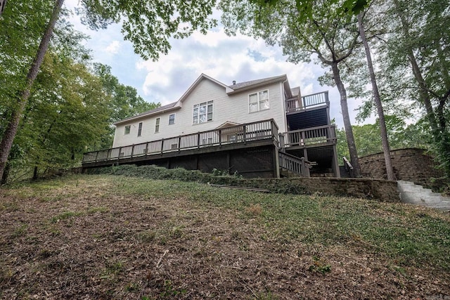 back of house with a wooden deck