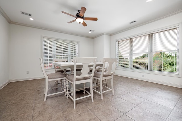 dining space featuring ceiling fan, crown molding, and light tile patterned floors