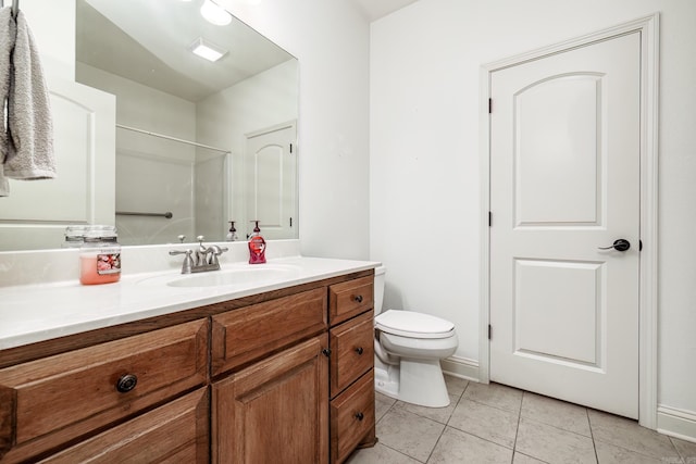 bathroom with tile patterned floors, vanity, and toilet