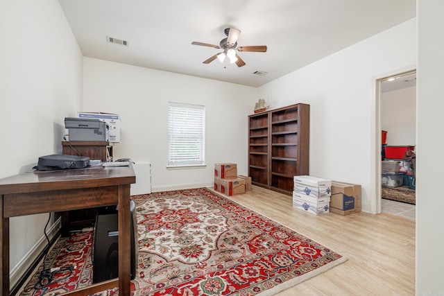 office featuring ceiling fan and light wood-type flooring