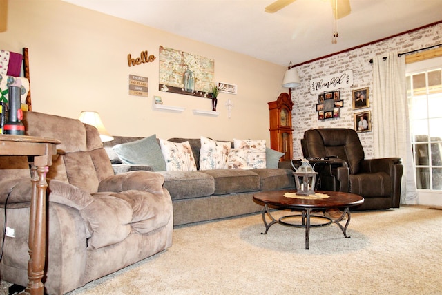 carpeted living room featuring ceiling fan