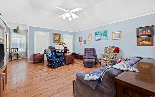 living room featuring crown molding, light hardwood / wood-style flooring, ceiling fan, and vaulted ceiling