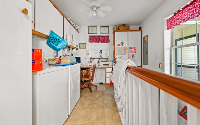 kitchen featuring separate washer and dryer and white cabinets