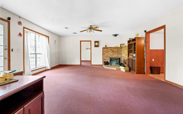 unfurnished living room featuring ceiling fan, light carpet, and a textured ceiling