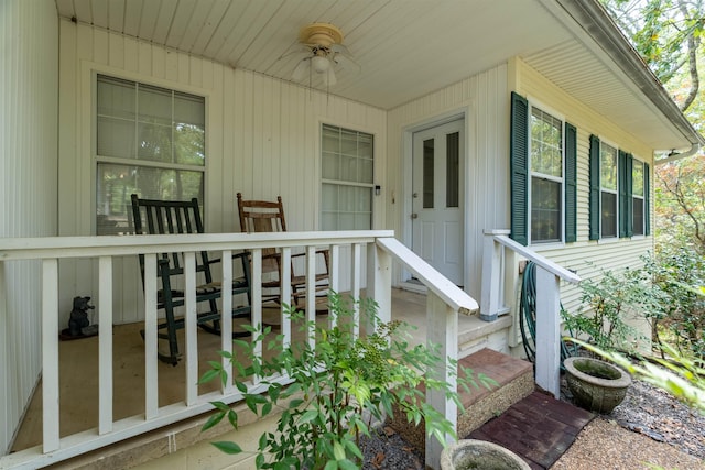 view of exterior entry with ceiling fan