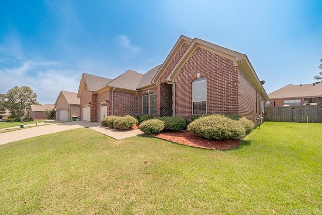 view of front of home with a front lawn and a garage