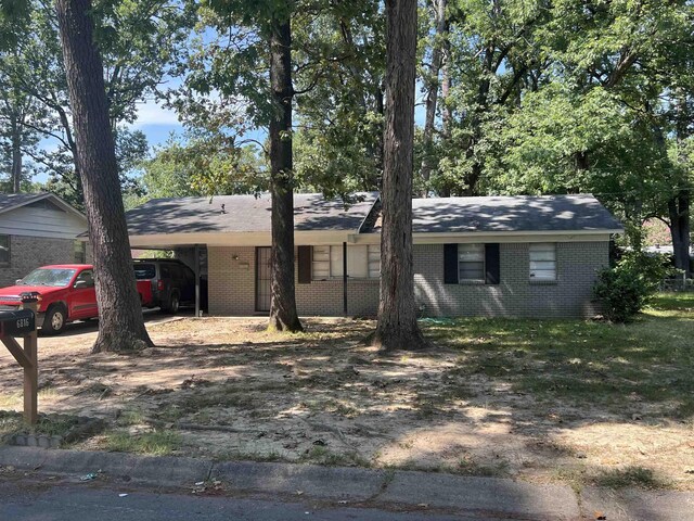 ranch-style house with a carport