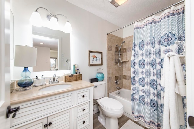 full bathroom with a textured ceiling, toilet, shower / bath combo with shower curtain, hardwood / wood-style flooring, and vanity