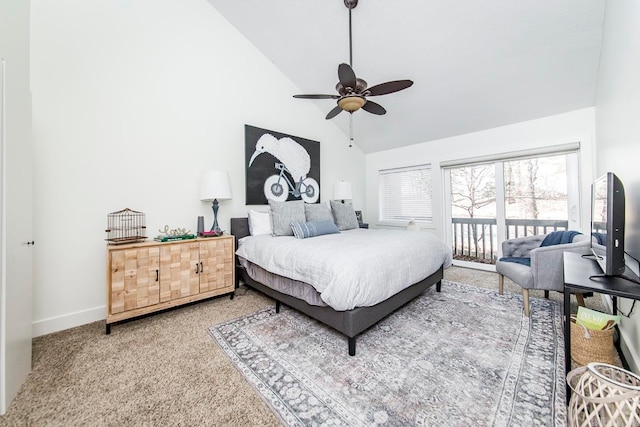 carpeted bedroom with ceiling fan and high vaulted ceiling