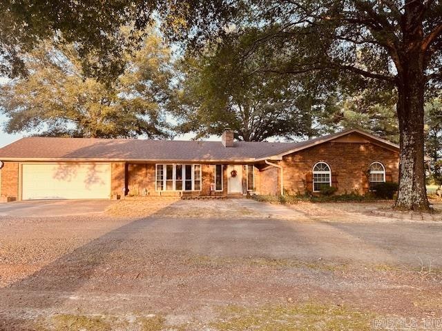 ranch-style house featuring a garage