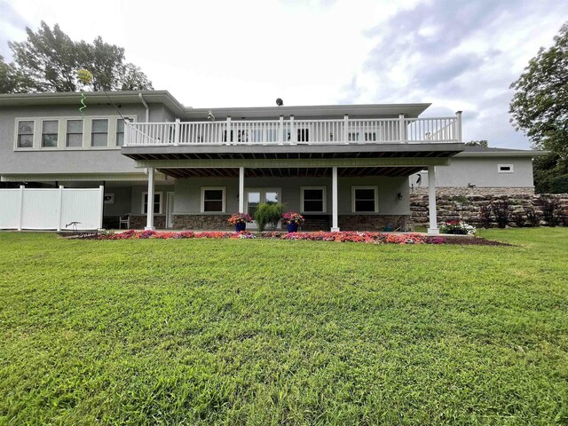 back of house with a yard