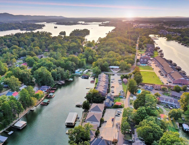 aerial view at dusk with a water view