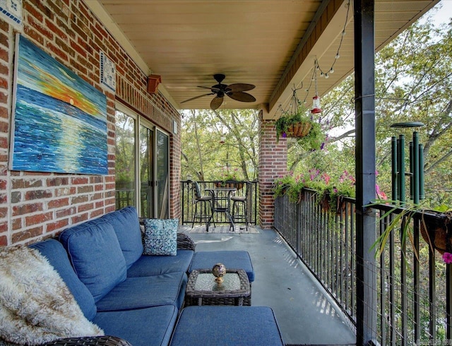 view of patio with ceiling fan and an outdoor living space