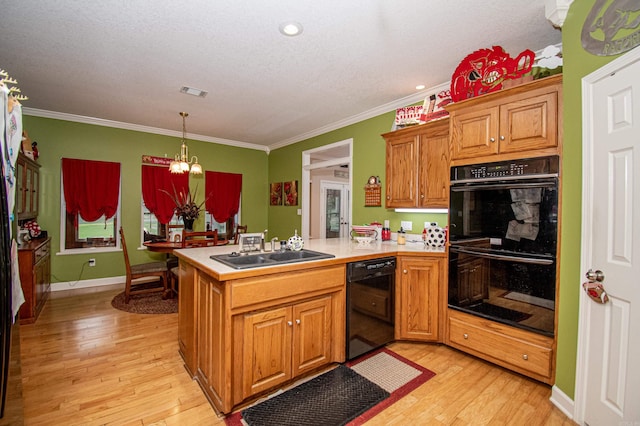 373 S Brandon, Fordyce, AR 71742 - kitchen featuring a sink, black appliances, light wood-type flooring, a peninsula, and a notable chandelier