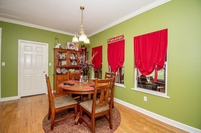 373 S Brandon, Fordyce, AR 71742 - dining space featuring baseboards, wood finished floors, and crown molding
