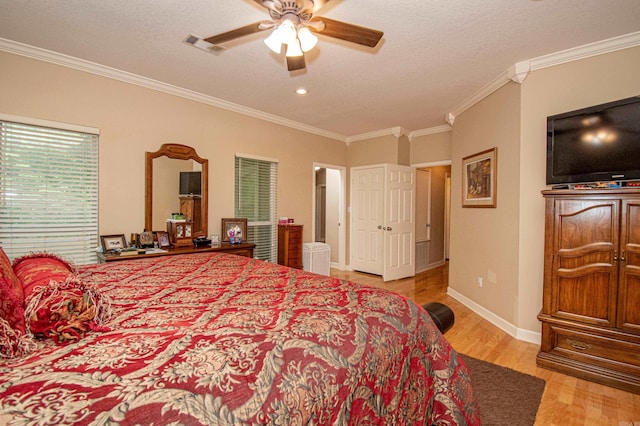 373 S Brandon, Fordyce, AR 71742 - bedroom with light wood-style floors, crown molding, a ceiling fan, visible vents, and baseboards