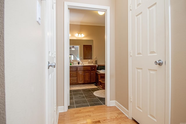 373 S Brandon, Fordyce, AR 71742 - bathroom with wood finished floors, ornamental molding, ceiling fan, vanity, and baseboards