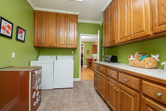 373 S Brandon, Fordyce, AR 71742 - clothes washing area featuring ornamental molding, washer and dryer, cabinet space, and light tile patterned flooring