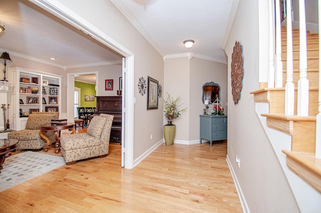 interior space with ornamental molding and light hardwood / wood-style floors