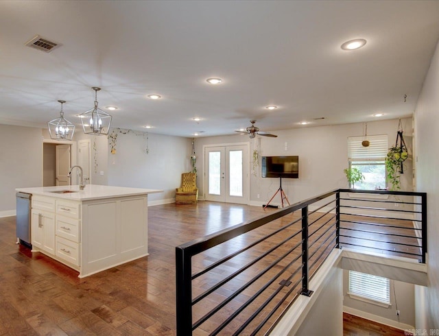 kitchen featuring white cabinets, sink, and dark hardwood / wood-style floors