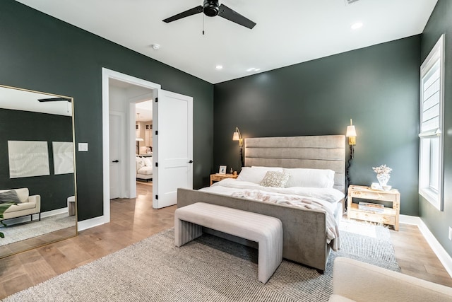 bedroom featuring ceiling fan and light hardwood / wood-style flooring