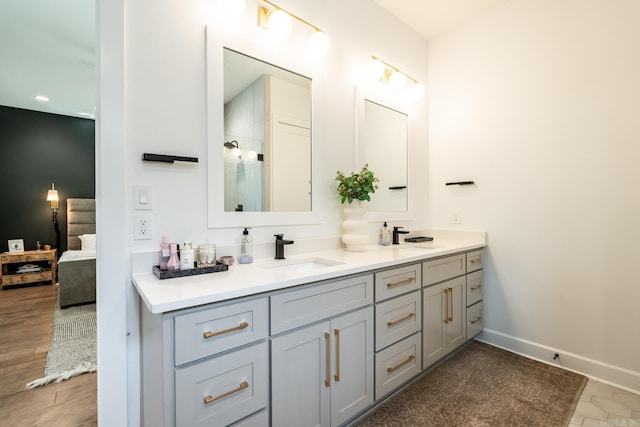 bathroom with vanity and wood-type flooring