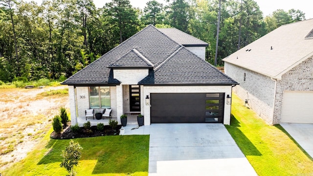 view of front facade with a front lawn and a garage