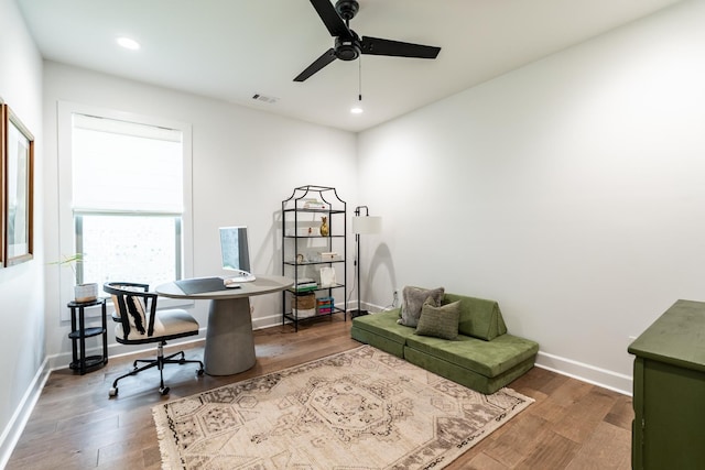 home office featuring hardwood / wood-style flooring and ceiling fan