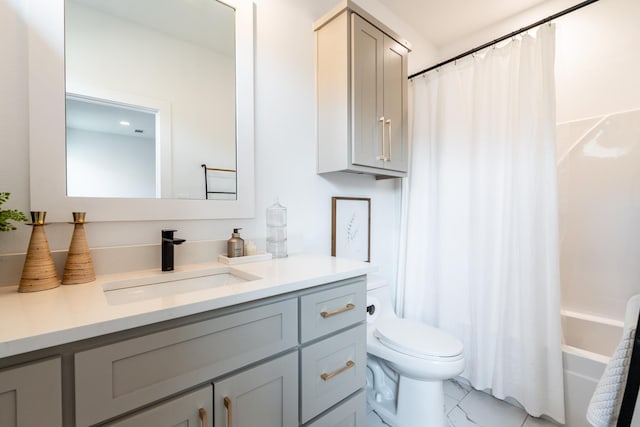 full bathroom featuring vanity, shower / tub combo with curtain, and toilet