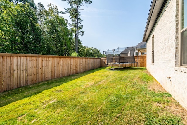 view of yard featuring a trampoline