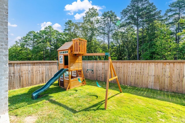 view of playground with a lawn