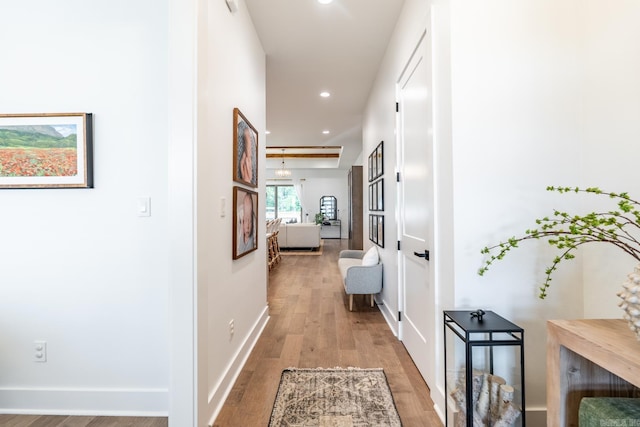 hall with wood-type flooring