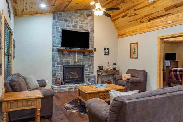 living room featuring high vaulted ceiling, wooden ceiling, a fireplace, wood finished floors, and a ceiling fan