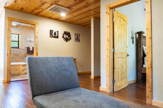 living area with wood ceiling and dark hardwood / wood-style floors