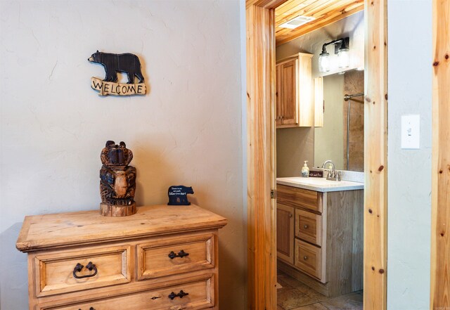 interior space featuring tile patterned floors and vanity