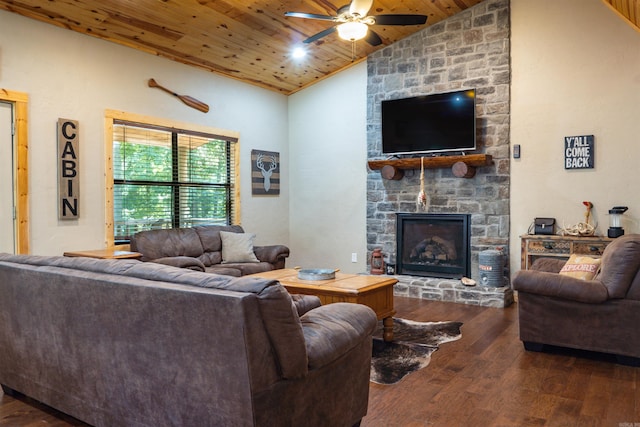 living room featuring wooden ceiling, a stone fireplace, dark hardwood / wood-style flooring, and vaulted ceiling