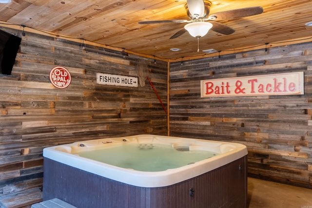 misc room with ceiling fan, wooden walls, and wooden ceiling