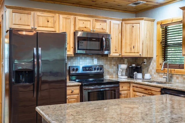 kitchen with black fridge with ice dispenser, sink, tasteful backsplash, range with electric cooktop, and light stone counters