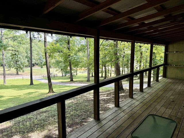 wooden deck featuring a lawn